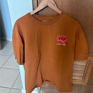 Saturdays NYC Rust Orange Graphic Tee with Red Floral Logo